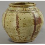 JIM MALONE (born 1946); a stoneware jar, combed decoration, green ash glaze, impressed JM mark,