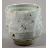 TAKESHI YASUDA (born 1943); a stoneware footed yunomi, slip trailed decoration and Chun glaze,