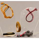 PETER COLLINGWOOD (1922-2008); five adjustable braided bangles, two zig-zag, two oval and another (