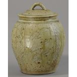 JIM MALONE (born 1946); a stoneware jar and cover, incised with fish motifs, green ash glaze,