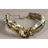 JOANNA MACKAY GRANA; a woven iron wire neckpiece, fool's gold and turquoise beads, drop length 23cm.