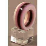 SARAH THIRLWELL; a chunky acrylic ring, purple, lilac and white, ring size R.

Provenance: Purchased