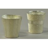 HIROSHI SUZUKI (born 1961); two hallmarked 999 grade fine silver beakers, hammer raised banded