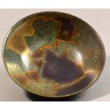 SUTTON TAYLOR (born 1943); an earthenware footed bowl, multiple layers of iridescent lustre