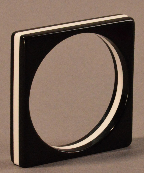 WENDY MASON; an acrylic bangle of square form in black and white, inner diameter 6.5cm.

Provenance: