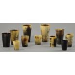Eleven polished horn cups of various sizes, largest height 13cm (11).