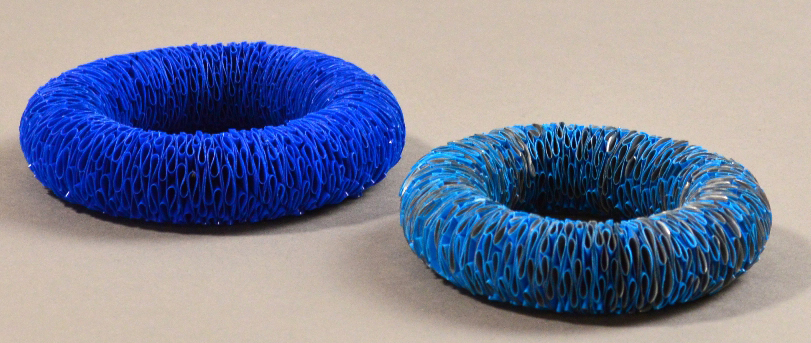 RACHEL DARBOURNE; two polythene bangles made from recycled carrier bags, bright blue and blue/