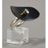 LESLEY STRICKLAND (born 1955); a hallmarked silver ring of large black resin dished oval form,