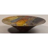 SUTTON TAYLOR (born 1943); a large earthenware footed flared bowl, multiple layers of lustre