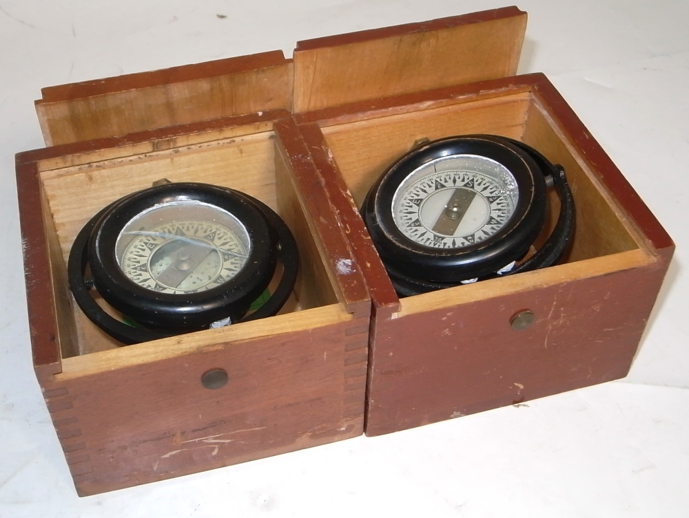 Two lifeboat gimbal compasses in original wooden boxes (2).