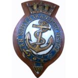 An oak mounted plaque inscribed “RN Supply & Transport Service”, length 31cm.