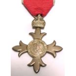 A cased George VI M.B.E. medal.