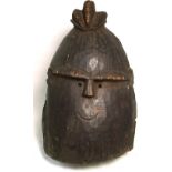 A 19th century helmet mask, Yourba, Nigeria, with raised coiffure,