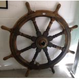 A late 19th century brass bound teak eight spoke ships wheel from a Welsh schooner transporting