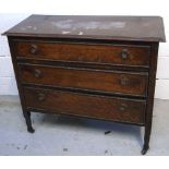 A small mid 20th century oak chest of drawers on castors.