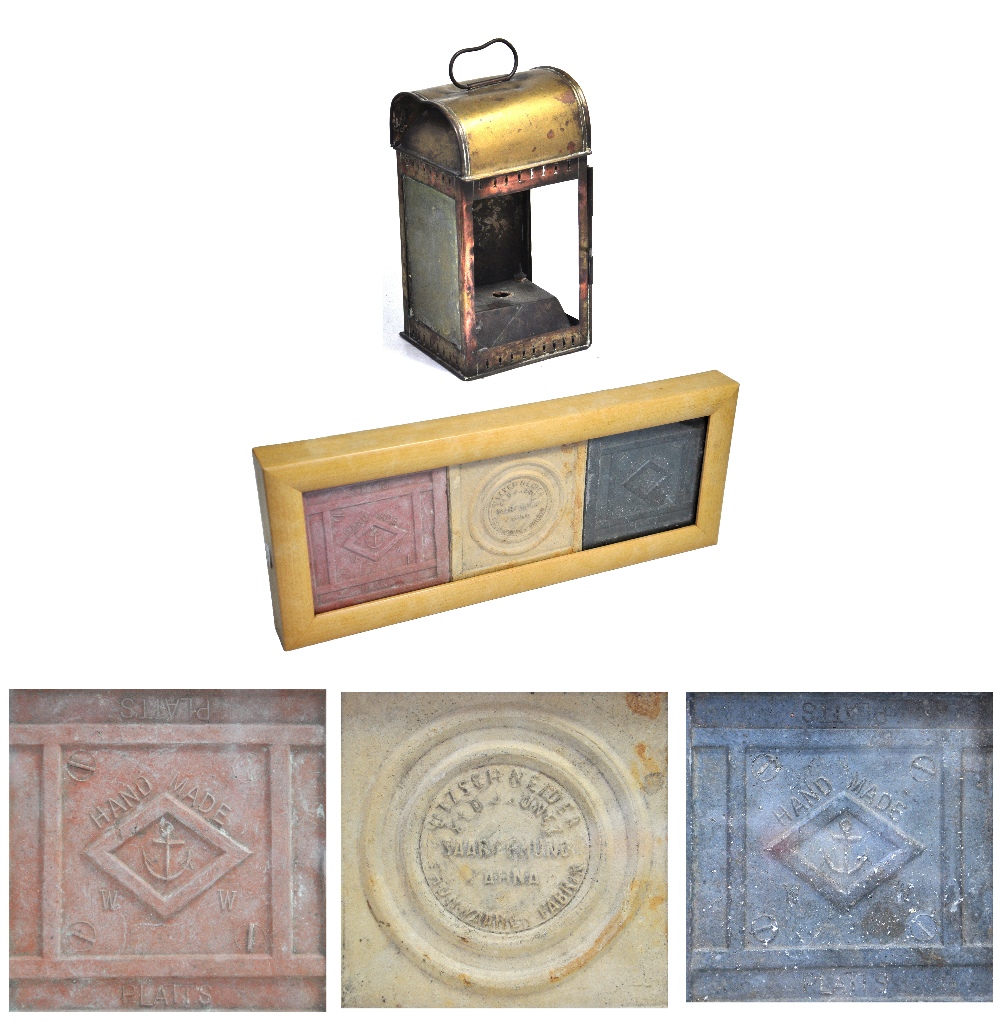 A brass ships lantern from "Brentwood" and a set of three ceramic floor tiles from a wreck in the