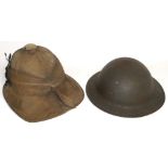 A WWI period dessert hat and a WWII period helmet (2).