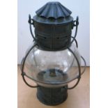 A brass ship's cabin globe lamp with stamped makers mark “Coal Salt & Tanning Co, Grimsby”,