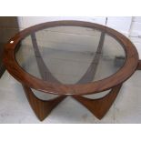 A G-plan circular glass topped coffee table, approx width 84cm.