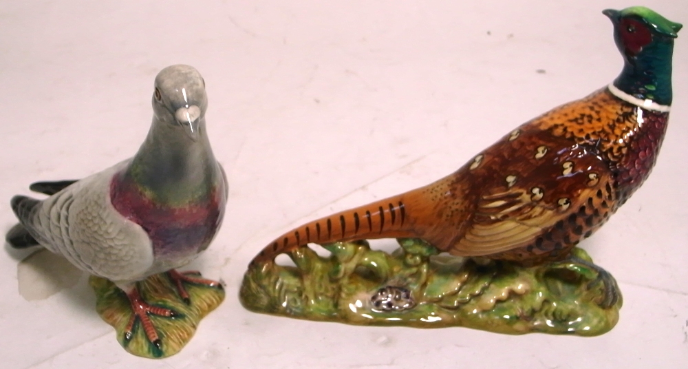 A Beswick model of a pigeon, height 14cm and a further Beswick model of a pheasant, width 18cm (2).