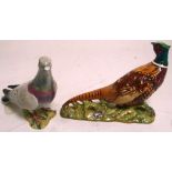 A Beswick model of a pigeon, height 14cm and a further Beswick model of a pheasant, width 18cm (2).