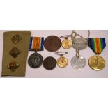 A group of medals and badges to include two WWI medals, a victory medal awarded to; 510511 SPR.O.