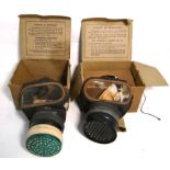 Two WWII boxed gas masks (2).