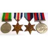 A group of WWII medals, a 1939-45 Star, a France and Germany Star,