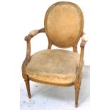 A 1920s/30s French style open arm elbow chair with floral upholstered back and seat and adjustable