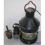 A Meteorite black painted ships lantern, height 72cm, a small black lamp and a vintage oil can (3).