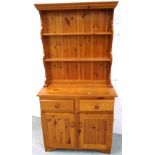 A contemporary pine dresser of small proportions,