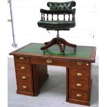 A 20th century leather inset desk, width 142cm and a matching green leather upholstered chair (2).