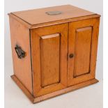 An Edwardian oak smoker's cabinet,