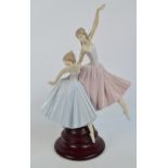 A large Lladro figure group of two ballerinas, height 49cm including wooden base. CONDITION