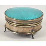 A George V hallmarked silver and turquoise guilloche enamel decorated circular jewellery box