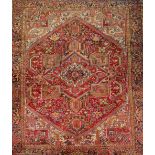 A Persian designed red ground carpet with allover floral decoration. CONDITION REPORT: 272cm x