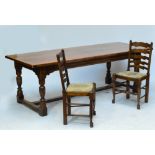 A large oak refectory table with rectangular top on turned stretchered supports, 229 x 90cm,