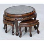 A modern Eastern hardwood nest of occasional tables,