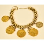 A 9ct gold bracelet supporting three full sovereigns in scrolling pendent mounts; 1898,