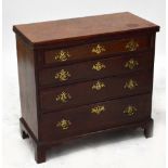 A George III mahogany bachelors chest, the hinged folding top above four graduated drawers raised on