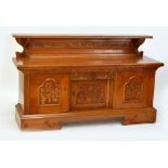 An early 20th century carved oak sideboard with raised back,