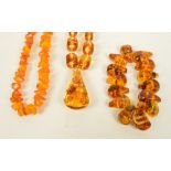 An amber coloured shaped bead necklace, length 70cm,