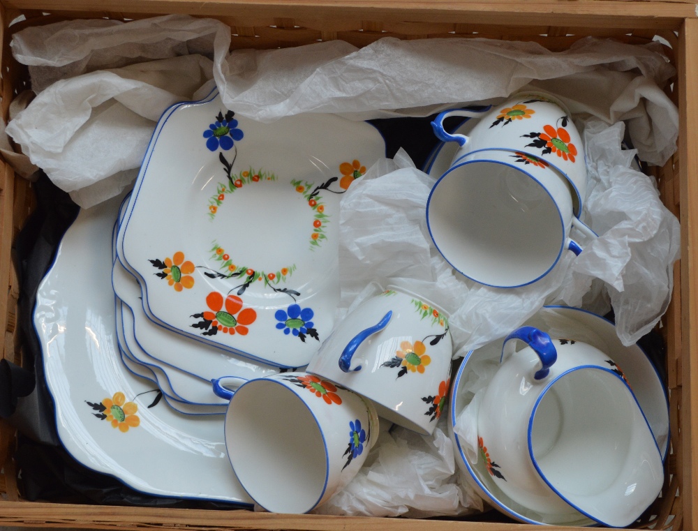 A part tea set of Grafton china with floral hand painted decoration, comprising four cups,