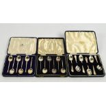 Three cased sets of six hallmarked silver coffee spoons, and with seal finials by Mappin & Webb,