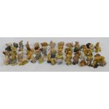 A collection of Wade Whimsies of wild and domesticated animals including lion, pig, penguin,