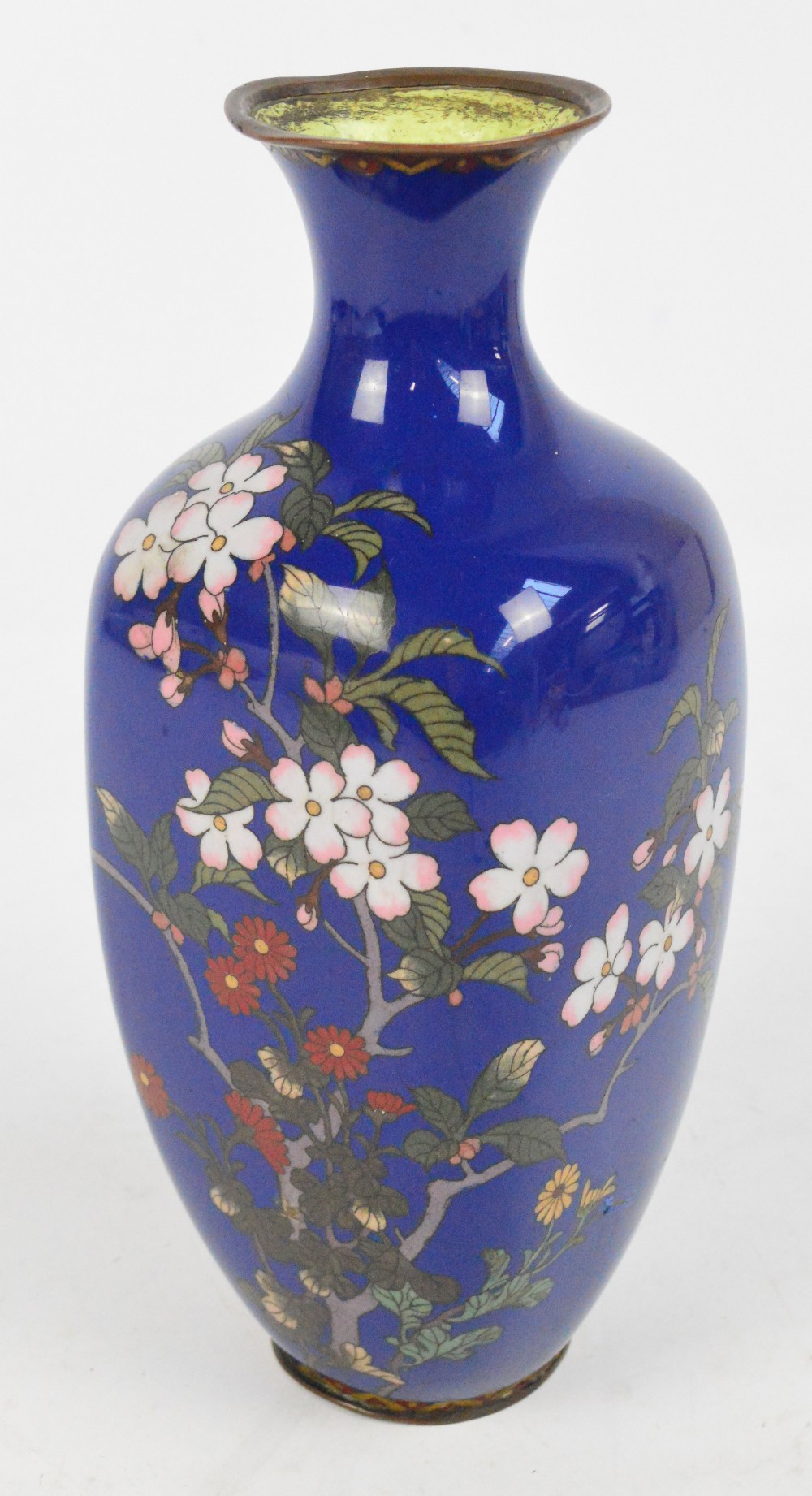 A Japanese Meiji period cloisonné enamel vase of square ovoid form with flared rim, decorated with