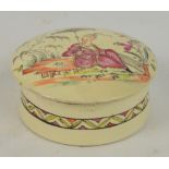 An 18th century Leeds creamware circular box and twist cover, painted with chinoiserie decoration to