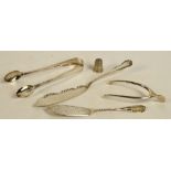 A pair of Edward VII hallmarked silver spring loaded sugar tongs in the form of a wishbone,