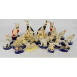 A quantity of late 19th century and reproduction Staffordshire animals including pen holders.