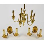 A brass ceiling lamp with five scrolling branches and urn shaped drop,